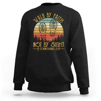 Black crewneck sweatshirt with “Walk by Faith Not by Sight” graphic, 2 Cor 5:7.