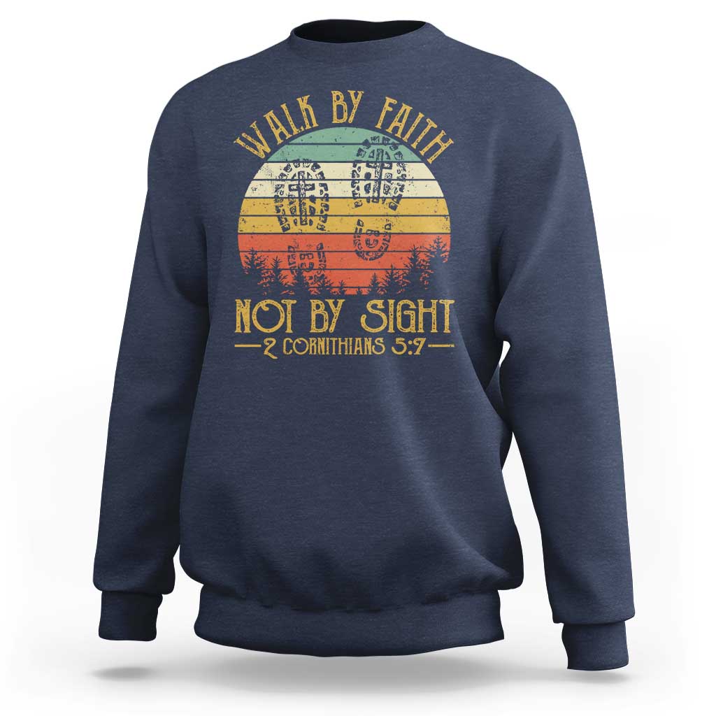Navy crewneck sweatshirt with “Walk by Faith Not by Sight” graphic, 2 Cor 5:7.