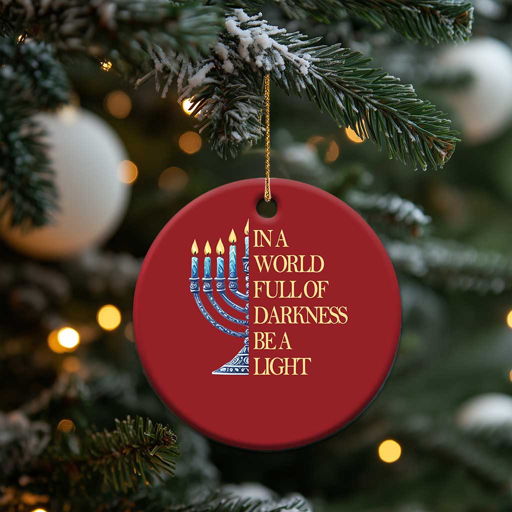 Red circular ornament with menorah illustration and “In a world full of darkness, be a light”