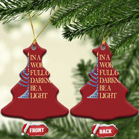 Two red bell-shaped ornaments shown from the front with menorah and quote text
