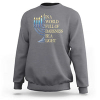 Charcoal gray Hanukkah sweatshirt with blue menorah and 'Be a Light' text graphic