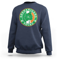 Navy sweatshirt with round “Shenanigans Squad” graphic featuring clover and hat