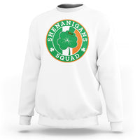 White sweatshirt with round “Shenanigans Squad” graphic featuring clover and hat