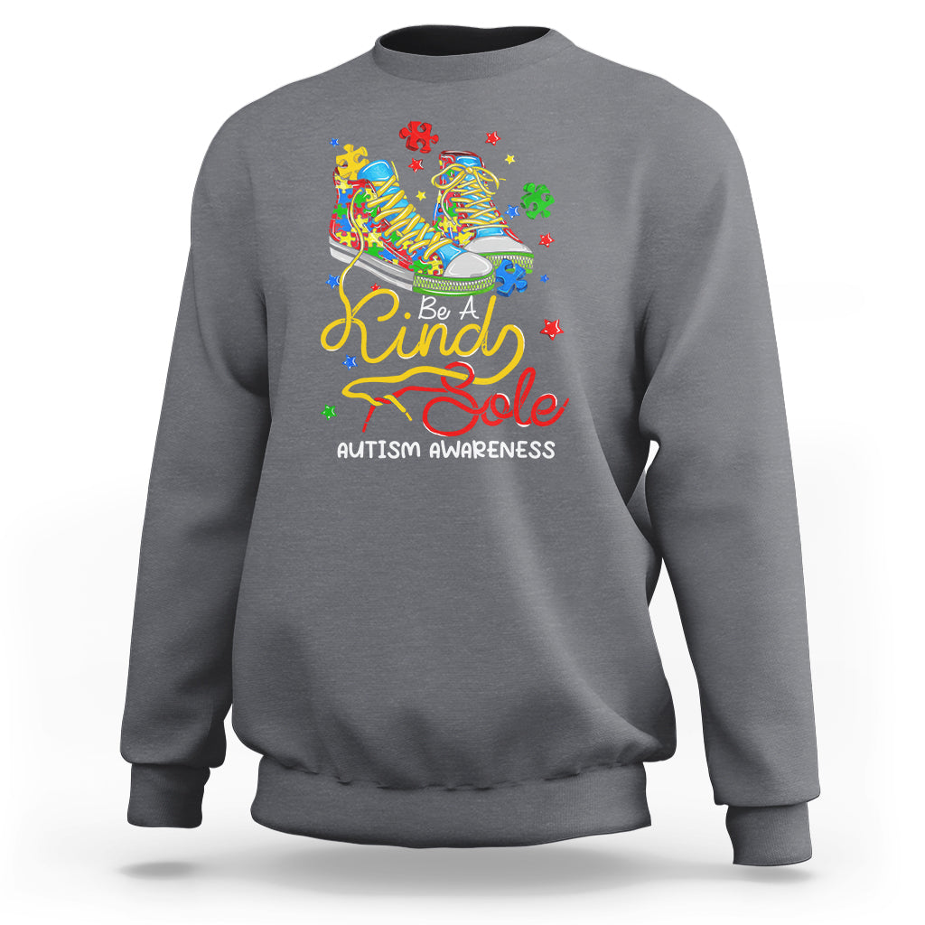 Charcoal gray autism awareness sweatshirt with colorful “Be a Kind Sole” puzzle shoe graphic
