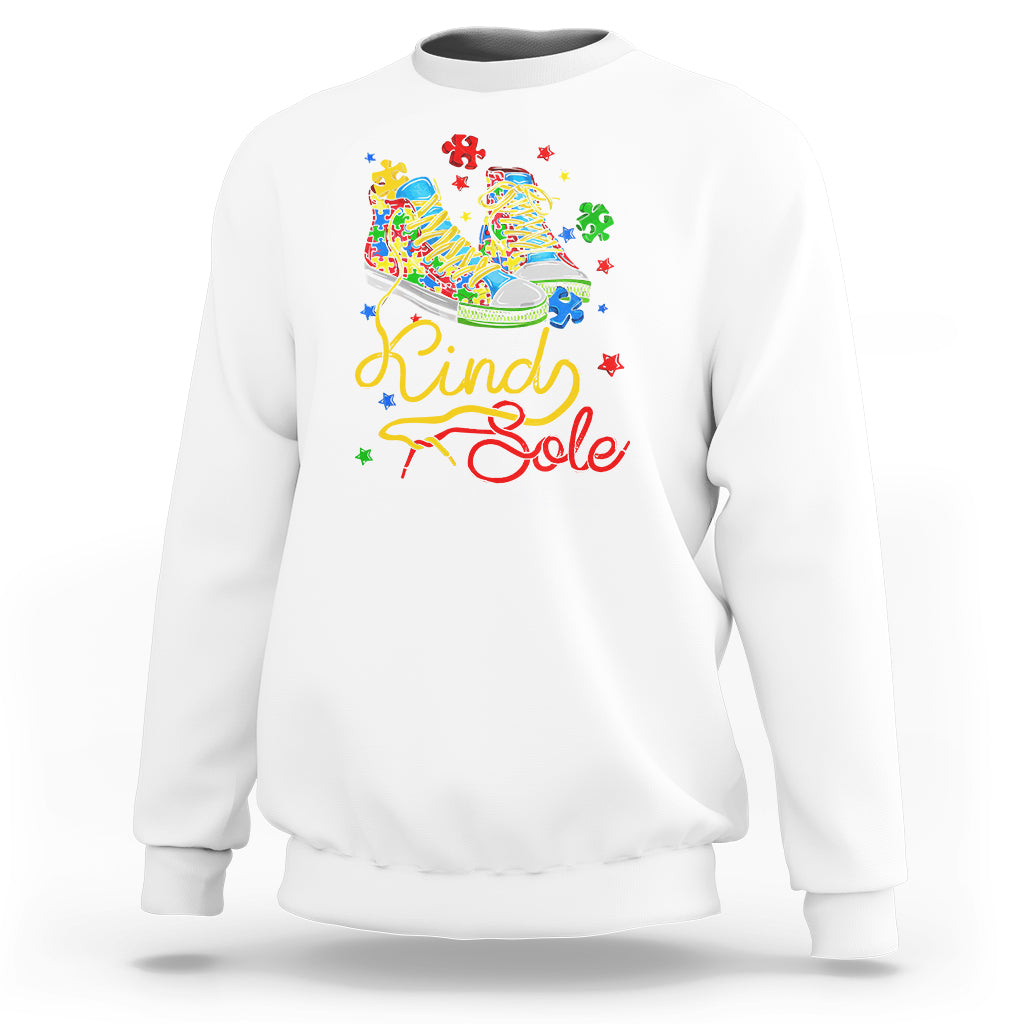 White autism awareness sweatshirt with colorful “Be a Kind Sole” puzzle shoe graphic