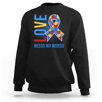 Black autism awareness sweatshirt with puzzle heart graphic and “NEEDS NO WORDS” text
