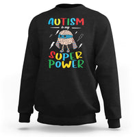 Black crewneck sweatshirt with colorful “AUTISM is my SUPER Power” front graphic