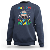 Navy crewneck sweatshirt with colorful “AUTISM is my SUPER Power” front graphic