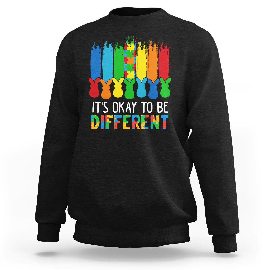 Black sweatshirt with rainbow bunny graphic and 'It's OK to be Different' text