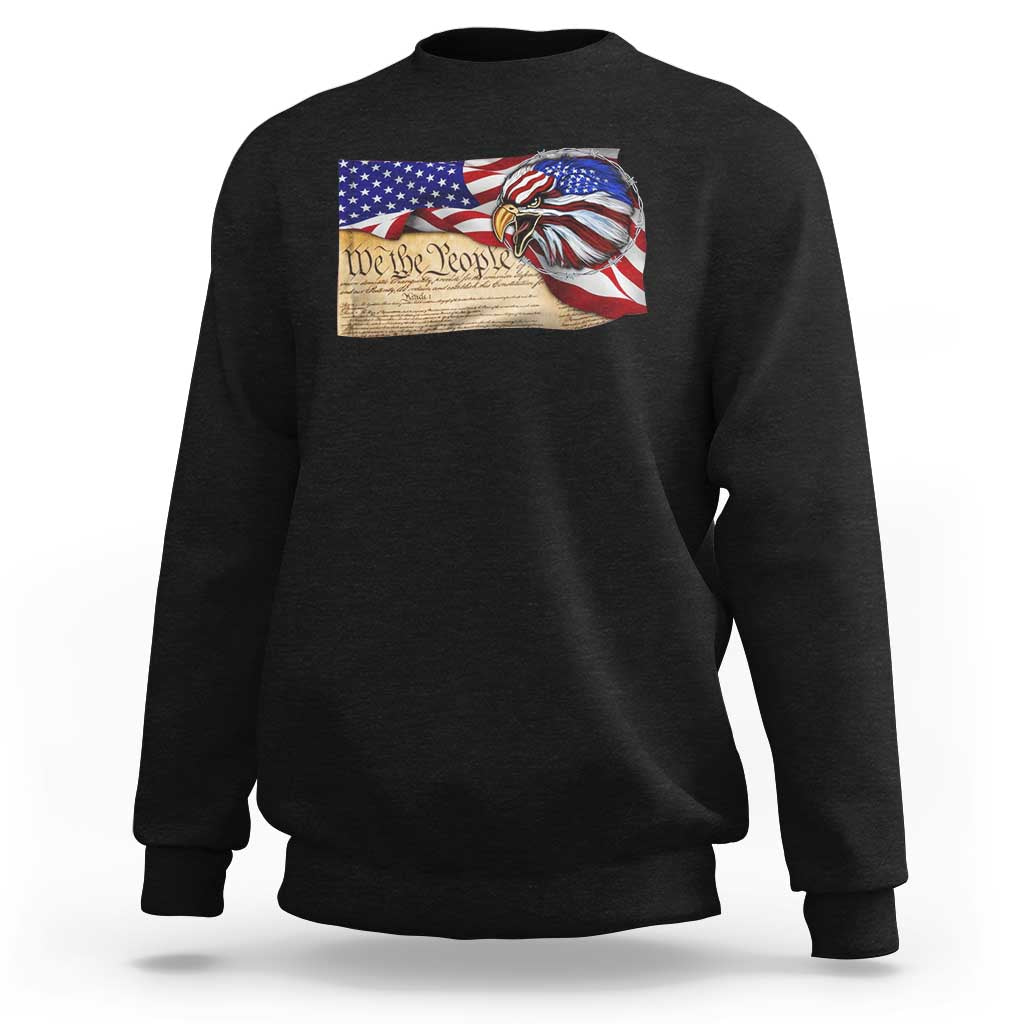 Black crewneck sweatshirt with 'We the People' eagle flag graphic on chest