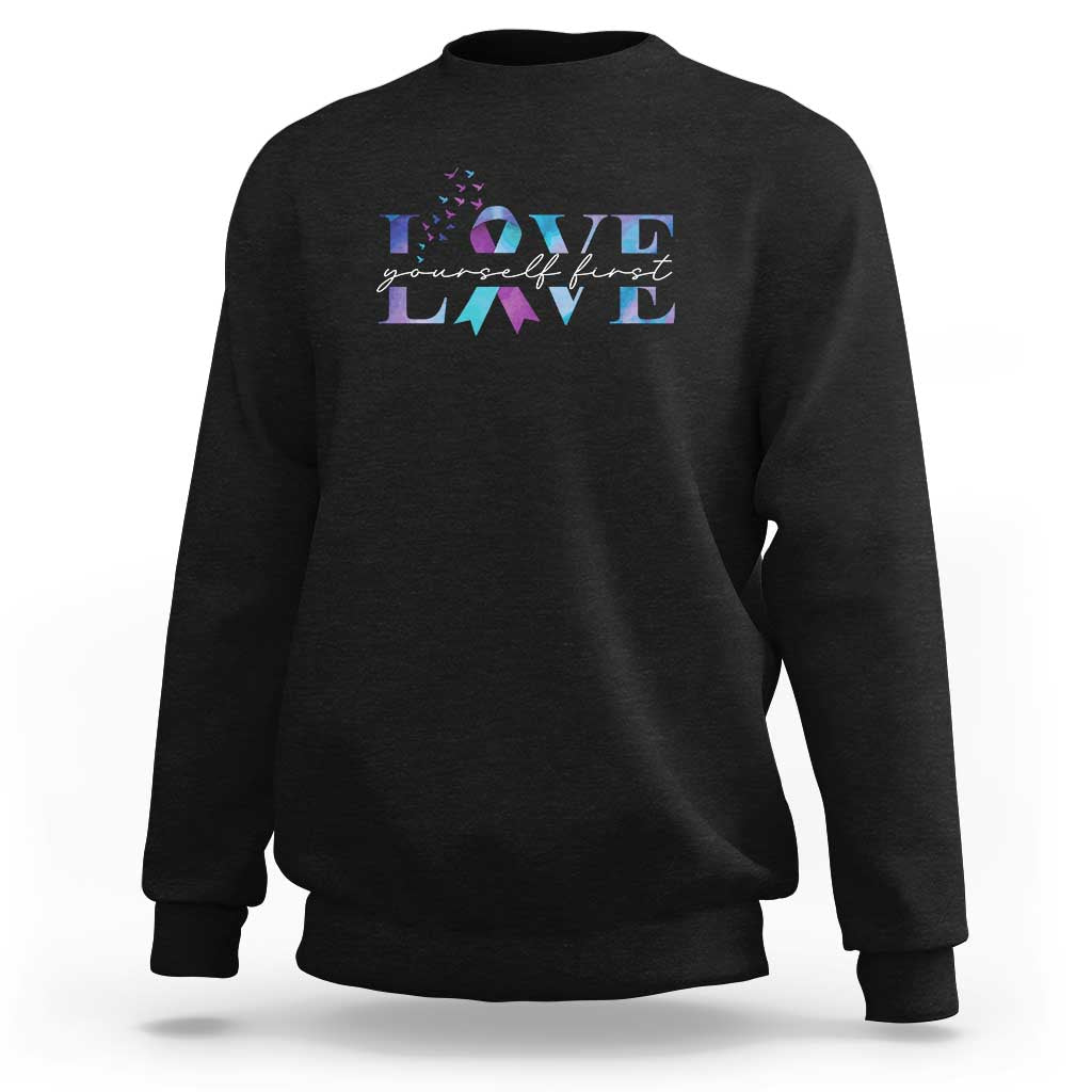 Black suicide prevention sweatshirt with 'LOVE' graphic on chest