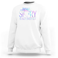 White suicide prevention sweatshirt with heart and “Your story is not over yet” print