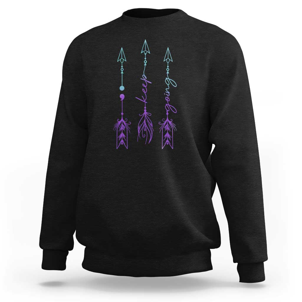 Black crewneck sweatshirt with purple and teal arrow-and-script graphic on back