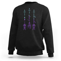Black crewneck sweatshirt with purple and teal arrow-and-script graphic on back
