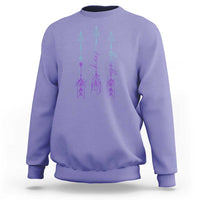 Lavender crewneck sweatshirt with purple and teal arrow-and-script graphic on back
