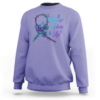 Lavender sweatshirt with Never Give Up text and floral ribbon graphic on front