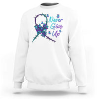 White sweatshirt with Never Give Up text and floral ribbon graphic on front