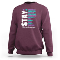 Maroon sweatshirt with colorful semicolon awareness graphic on back