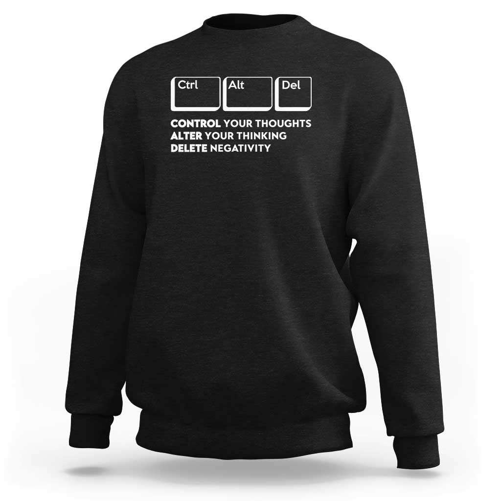 Black crewneck sweatshirt with Ctrl Alt Del graphic and “Delete Negativity” text