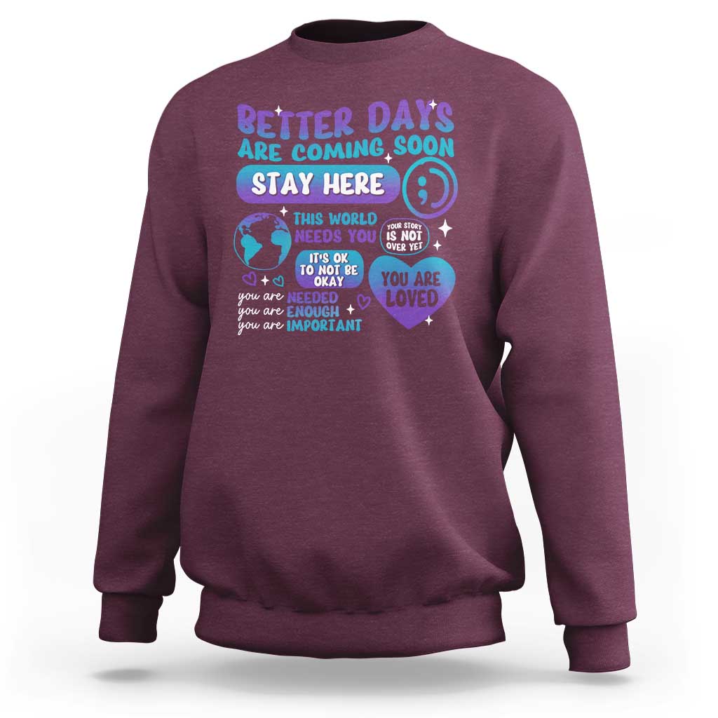 Maroon unisex sweatshirt with “Stay Here” suicide prevention message graphic on front