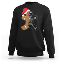 Black sweatshirt with cartoon gingerbread character and skeleton nurse graphic on chest