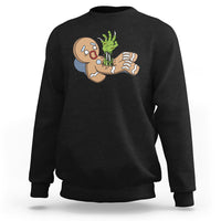 Black crewneck sweatshirt with zombie gingerbread graphic on the chest