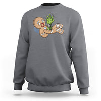 Charcoal crewneck sweatshirt with zombie gingerbread graphic on the chest