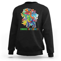 Black crewneck sweatshirt with colorful dinosaur puzzle graphic and green slogan text.