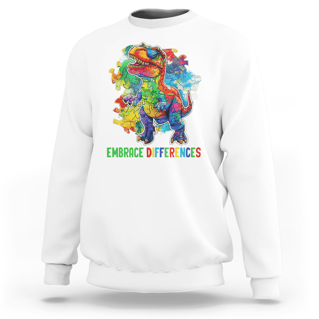 White crewneck sweatshirt with colorful dinosaur puzzle graphic and green slogan text.