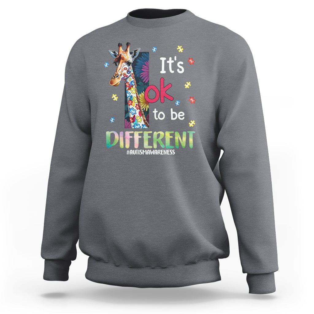 Charcoal autism awareness sweatshirt with colorful giraffe graphic and 'It's ok to be different'.