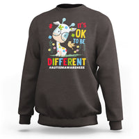 Dark chocolate autism awareness sweatshirt with giraffe graphic and 'It’s OK to be different'