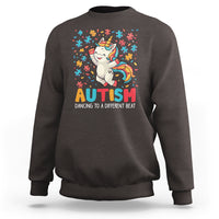Dark chocolate crewneck sweatshirt with unicorn puzzle graphic and “AUTISM” text on the front