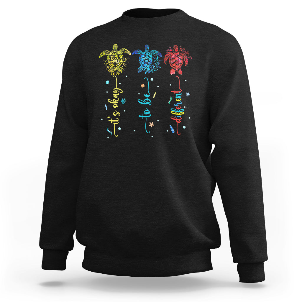 Black crewneck sweatshirt with colorful sea turtle autism awareness graphic on back