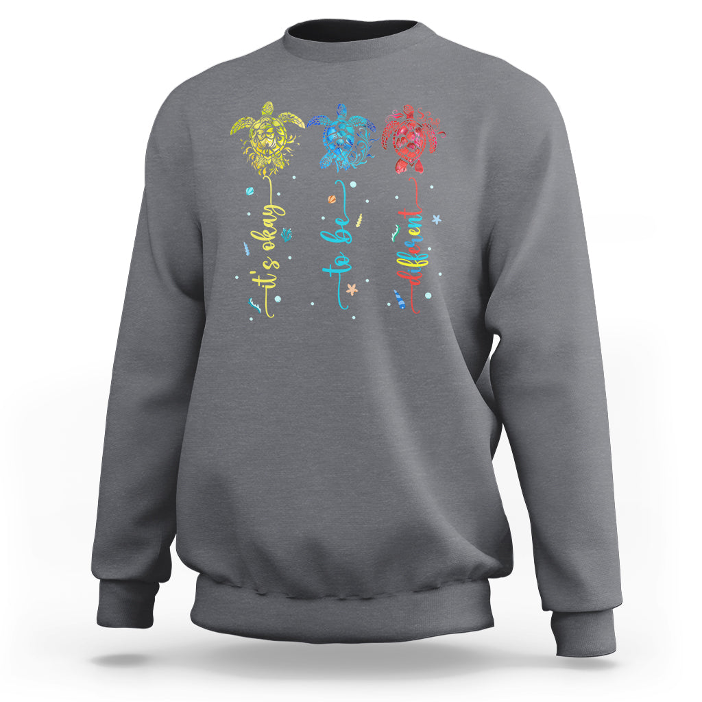 Charcoal crewneck sweatshirt with colorful sea turtle autism awareness graphic on back
