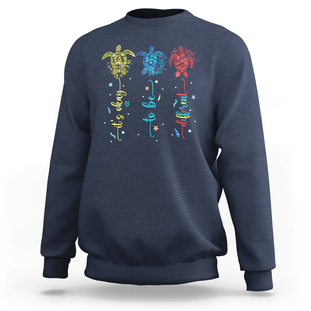 Navy crewneck sweatshirt with colorful sea turtle autism awareness graphic on back