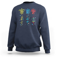 Navy crewneck sweatshirt with colorful sea turtle autism awareness graphic on back