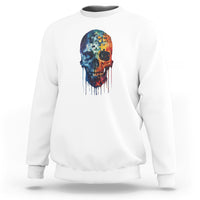 White crewneck sweatshirt with colorful puzzle skull graphic on the chest.