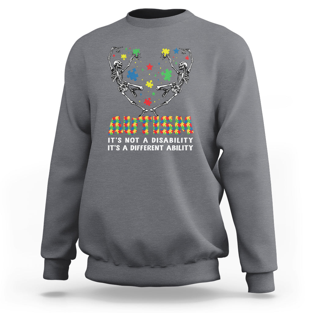 Charcoal gray autism awareness crewneck sweatshirt with skeleton puzzle graphic and rainbow text