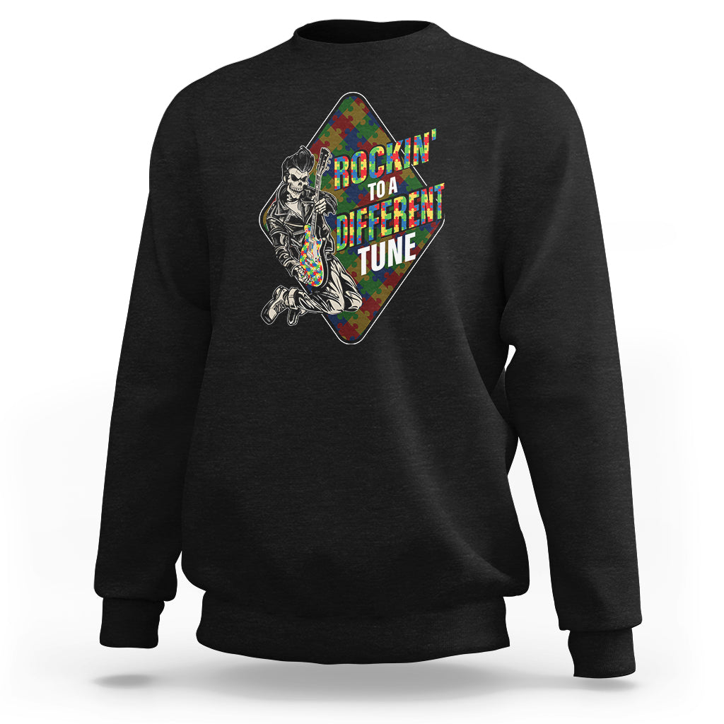 Black autism awareness sweatshirt with colorful puzzle-piece skeleton graphic on front