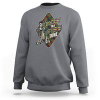 Charcoal gray autism awareness sweatshirt with colorful puzzle-piece skeleton graphic on front