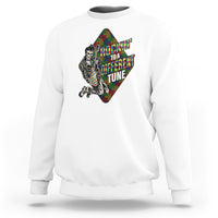 White autism awareness sweatshirt with colorful puzzle-piece skeleton graphic on front