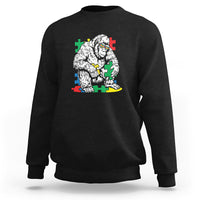 Black crewneck sweatshirt with Bigfoot puzzle warrior graphic on chest