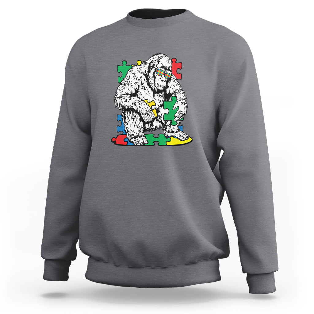 Charcoal gray crewneck sweatshirt with Bigfoot puzzle warrior graphic on chest