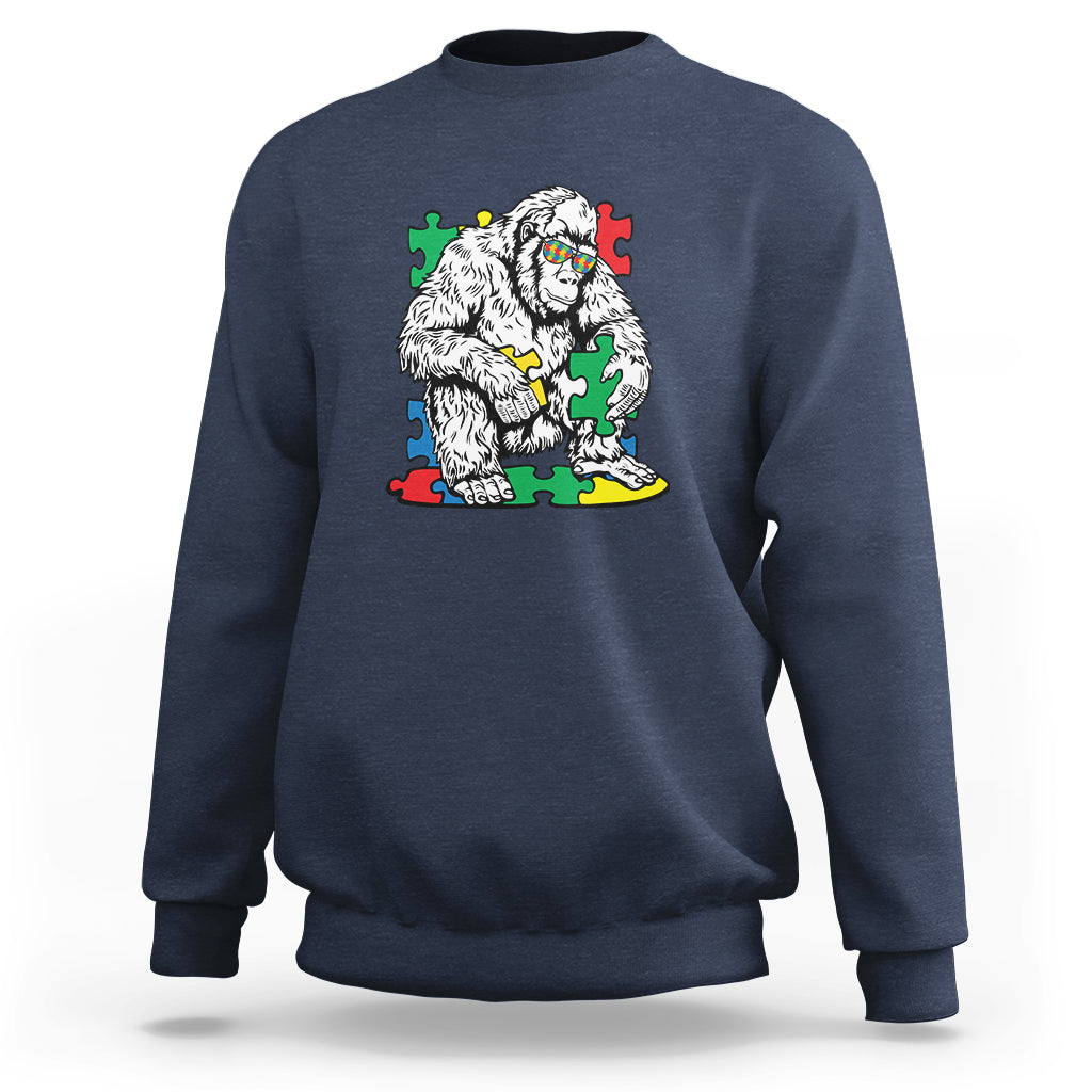 Navy crewneck sweatshirt with Bigfoot puzzle warrior graphic on chest