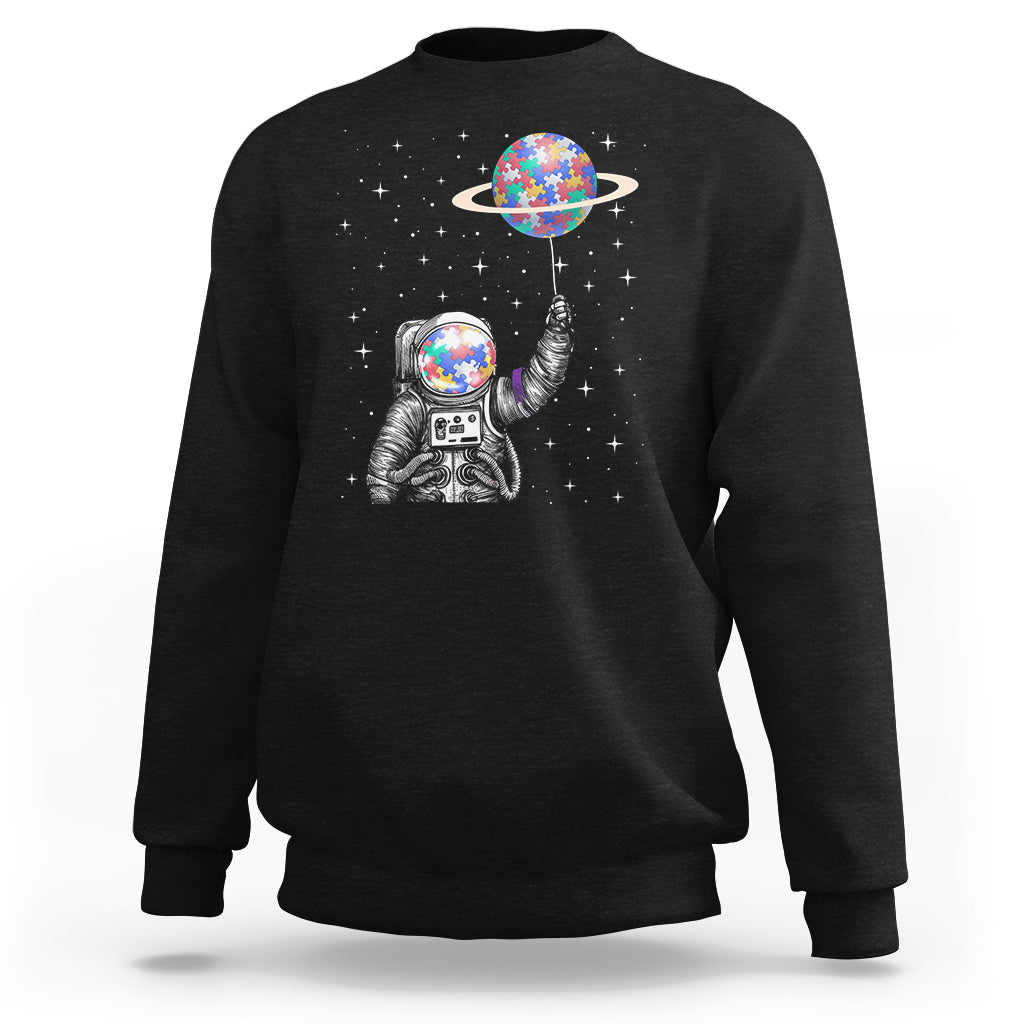 Black astronaut graphic sweatshirt with colorful planet balloon and stars
