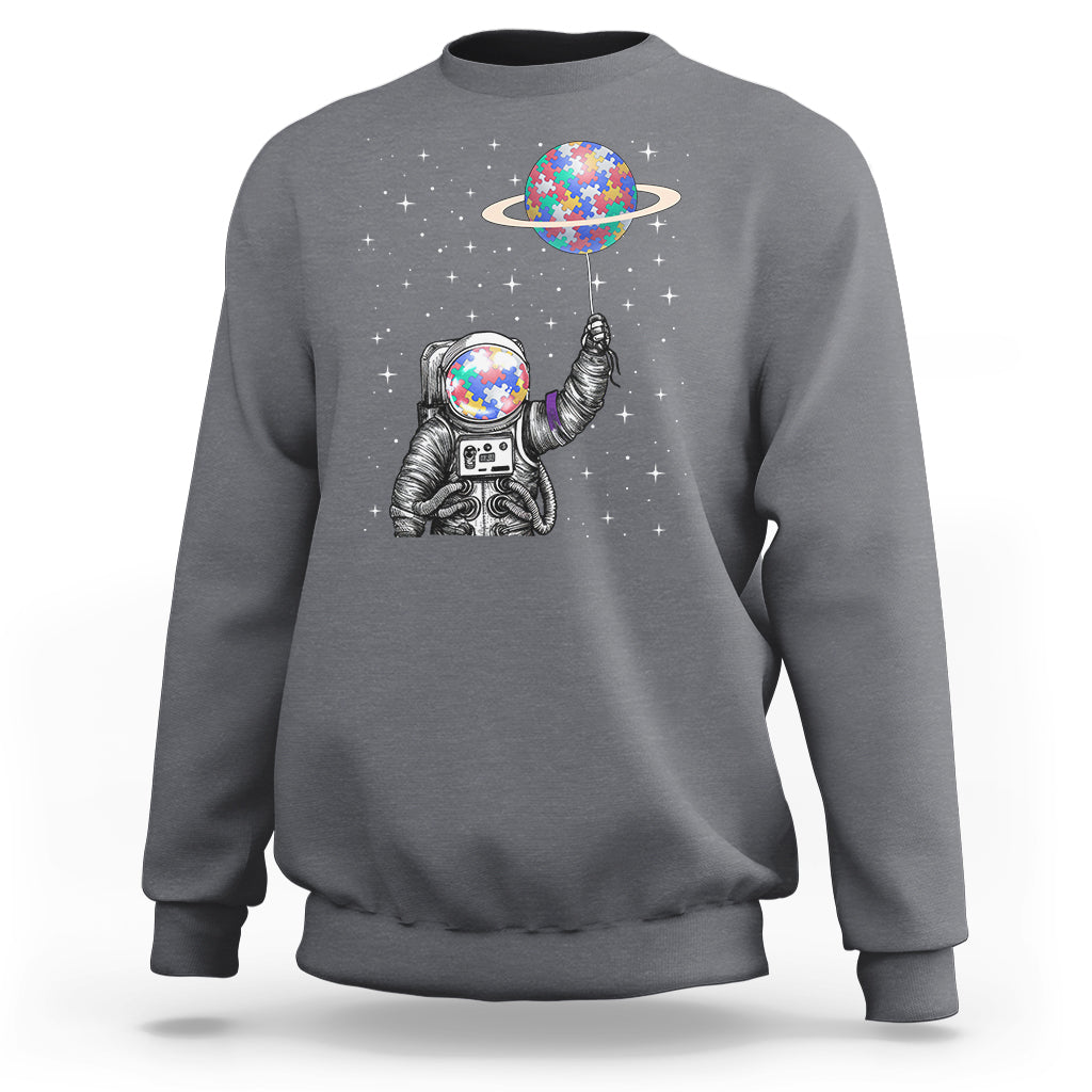Charcoal astronaut graphic sweatshirt with colorful planet balloon and starry design