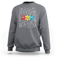 Charcoal gray sweatshirt with colorful science puzzle graphic on the chest.