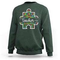 Dark forest green teacher autism awareness sweatshirt with colorful elephant graphic on chest