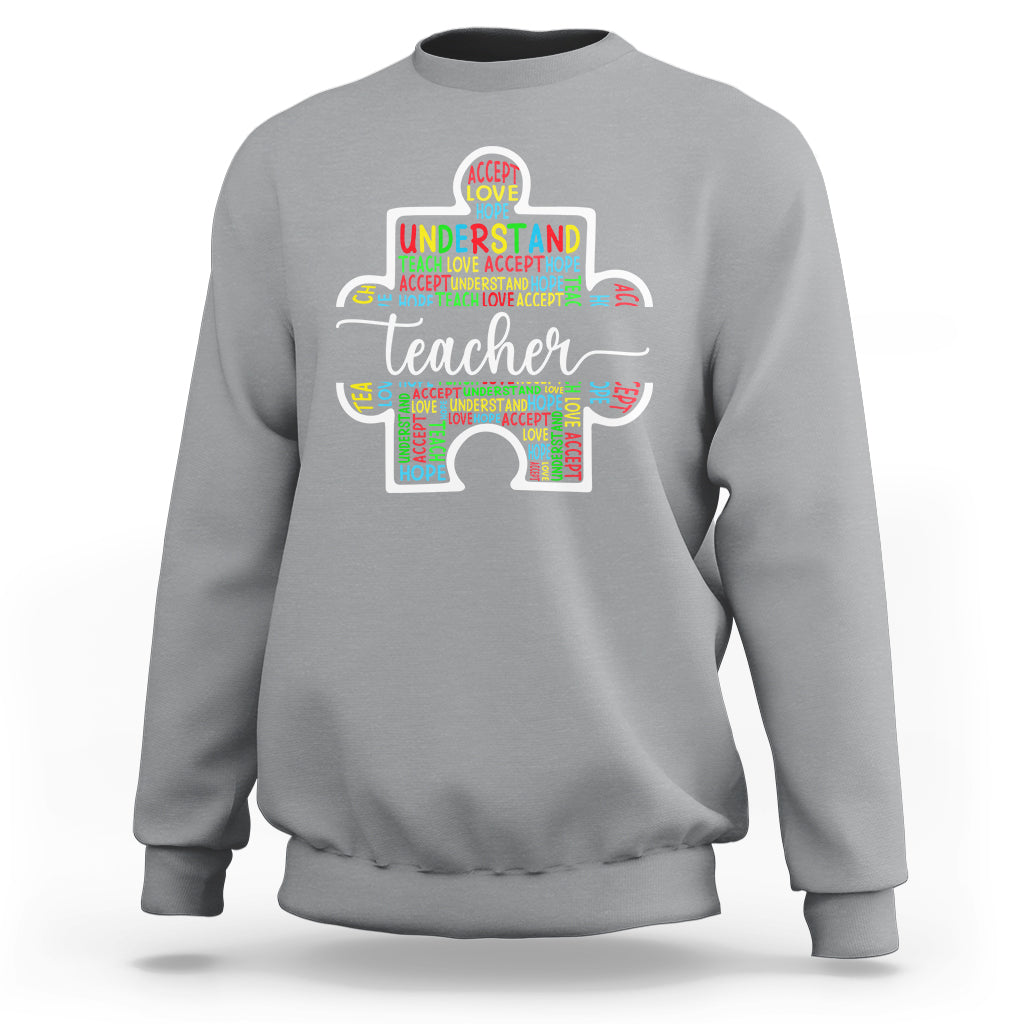 Light gray teacher autism awareness sweatshirt with colorful elephant graphic on chest