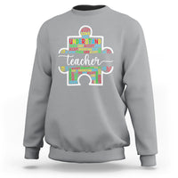 Light gray teacher autism awareness sweatshirt with colorful elephant graphic on chest